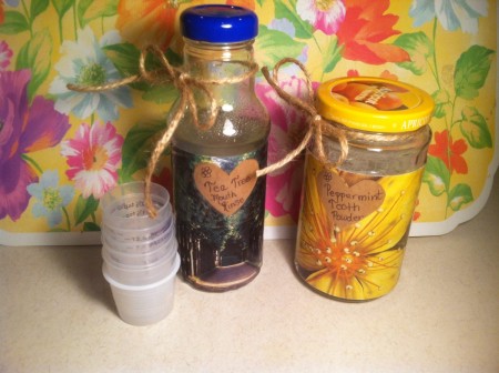 Jars of mouth rinse and tooth powder.