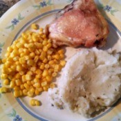 plate with corn, chop, and mashed potatoes