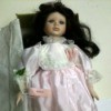 doll with dark hair and wearing pink dress
