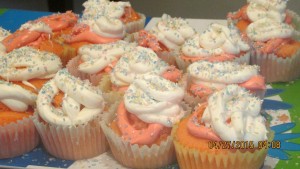 A plate of frosted cupcakes with fairy dust.