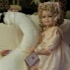 doll sitting on a swan