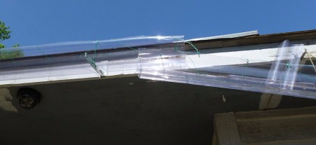 A clear shield for a roof rain gutter.