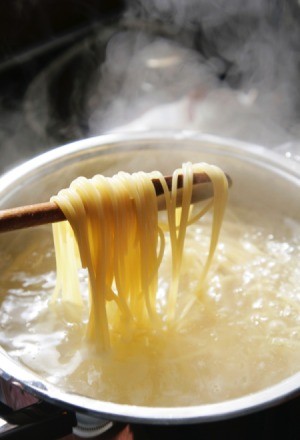 A pot of cooking pasta.