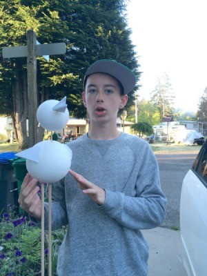 Geometry Bird Project - middle school boy holding a Styrofoam bird project