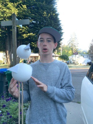 Geometry Bird Project - middle school boy holding a Styrofoam bird project