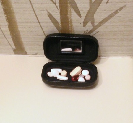 Store pills in a contact lens case.