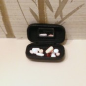 Store pills in a contact lens case.