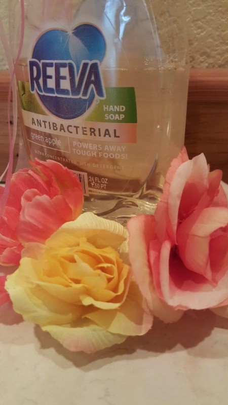 bottle of dish soap with roses in front