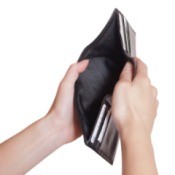 A person holding an empty wallet