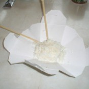 open container with rice and chop sticks