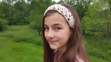 young girl wearing headband