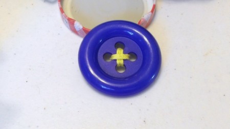 Assembling a button magnet.