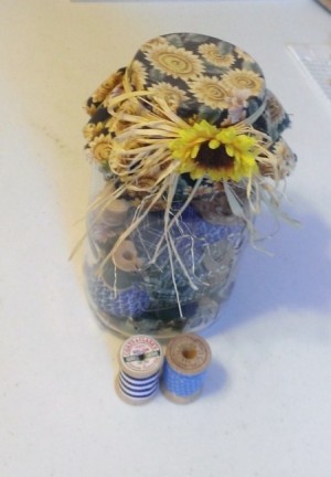 jar with 20 covered thread spools