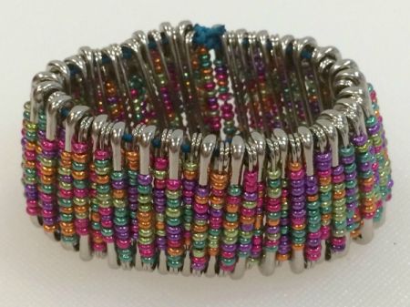 Colorful bracelet made with safety pins and beads.