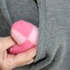 pink heart shaped hand warmer going into pocket
