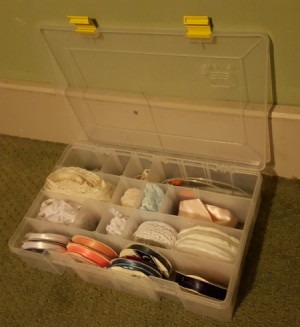 open fishing supply box with craft supplies