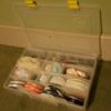 open fishing supply box with craft supplies