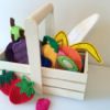 small wooden basket with a variety of handcrafted felt fruit