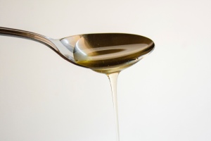 spoon with drizzling agave syrup