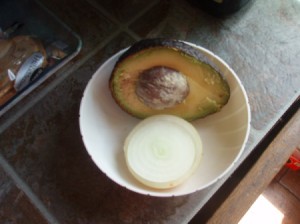avocado half with onion slice