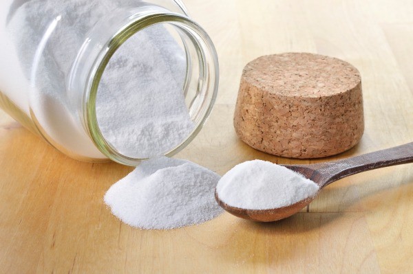 glass jar with baking soda and spoon