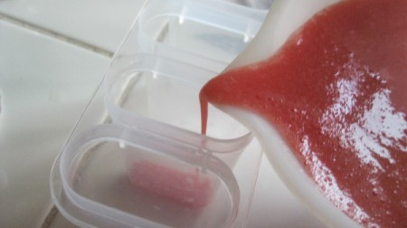 Watermelon-Strawberry Popsicles -
 pouring into molds