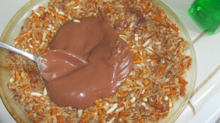 spreading chocolate on crust