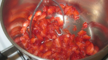 crushing strawberries