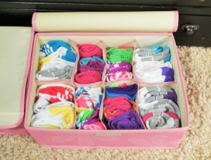 A sock drawer organizer filled with socks.
