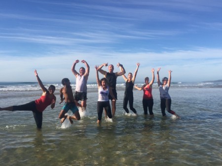 people in athletic attire at the beach