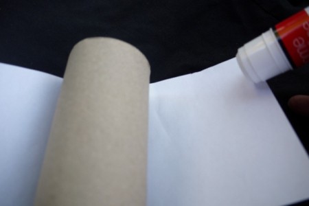 Easy Recycled Owl - Gluing paper to the toilet paper tube.