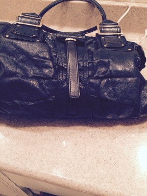 An old worn out leather handbag.