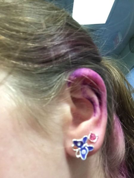 ear with purple dye on it