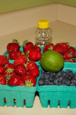 A berry fruit salad with lime and honey.