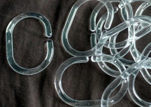 Clear shower curtain rings, ready to use.