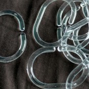 Clear shower curtain rings, ready to use.