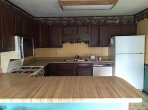 kitchen cabinets, countertop, and tile