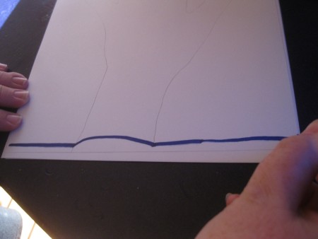 Lines drawn over a traced handprint.