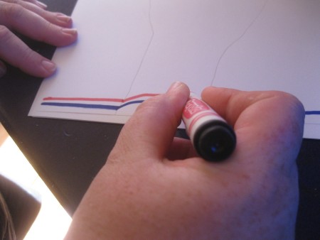 Lines drawn over a traced handprint.