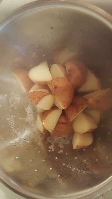 boiled potatoes in strainer
