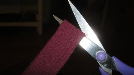 Cutting the t-shirt collar.