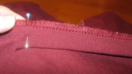 Replacing the collar on a newly altered t-shirt.