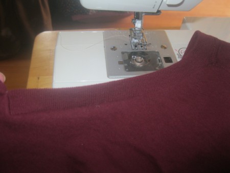 Replacing the collar on a newly altered t-shirt.