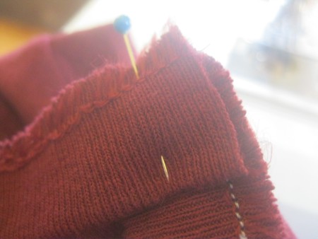 Replacing the collar on a newly altered t-shirt.