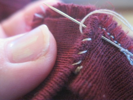 Replacing the collar on a newly altered t-shirt.