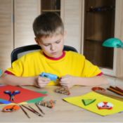 boy making Christmas decorations