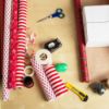 paper, scissors, tape, and other gift wrap supplies