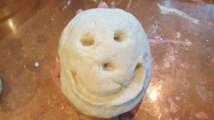ball of clay with smiley face