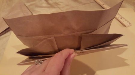 A folded paper bag to make an envelope.