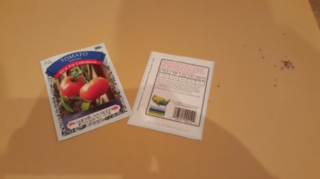 A seed packet cut in half to use both front and back.
